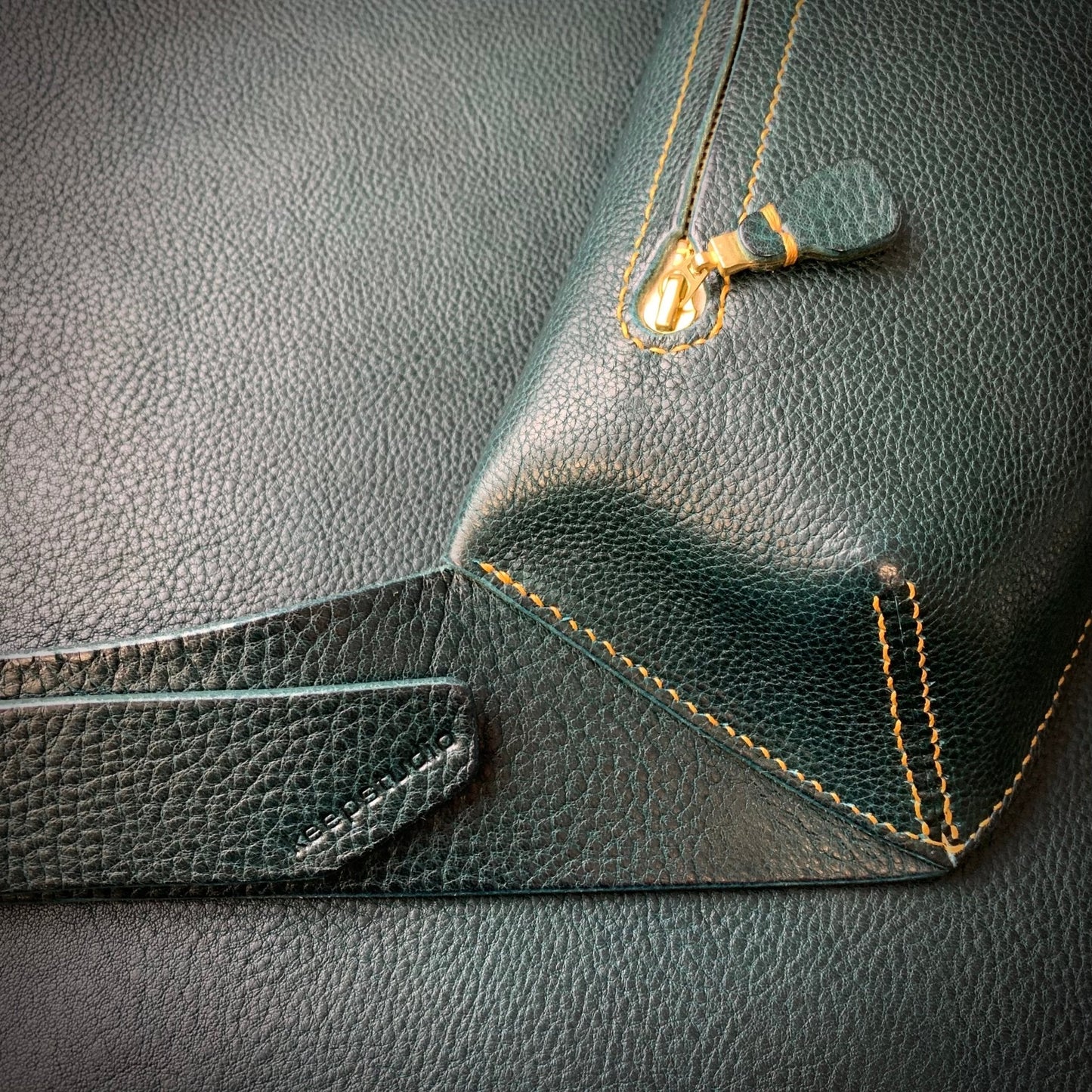 Elton Leather Belt Bag - Large - Keep - Studio close up of the cross body belt bag in petrol leather with mustard stitching