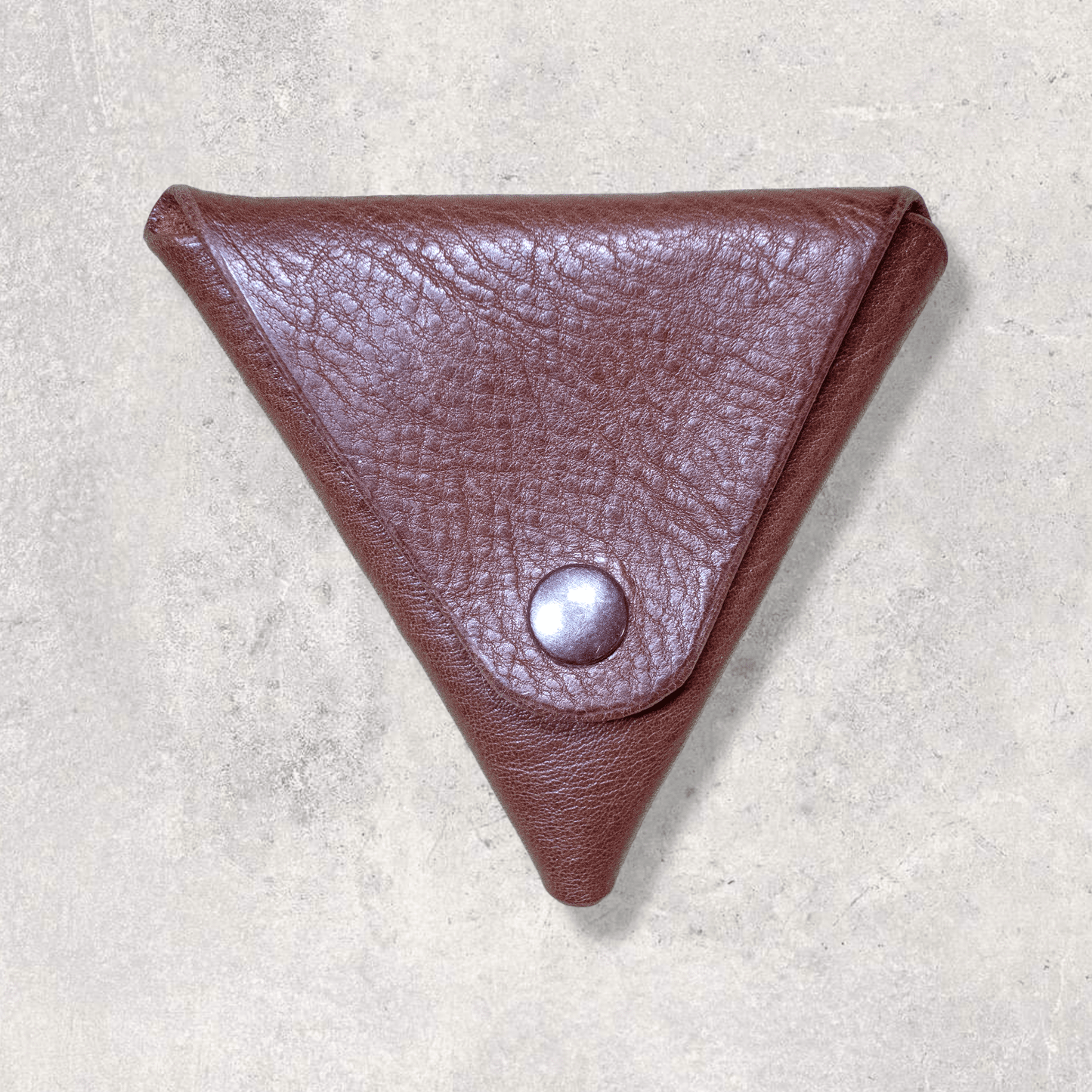 A triangle Leather Pouch purse style wallet in brown leather with antique brass poppers