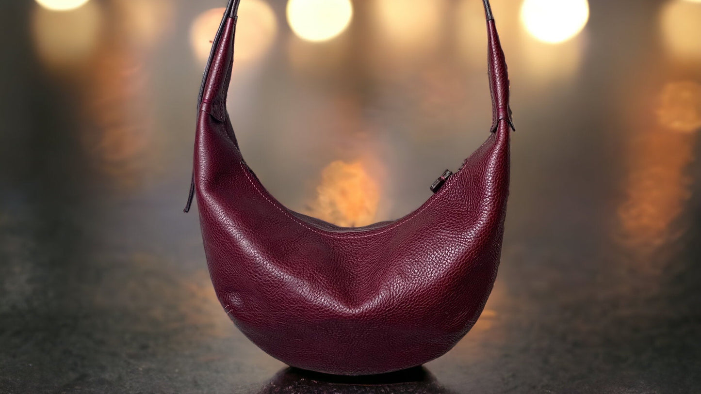 Crescent shaped bag in burgundy leather