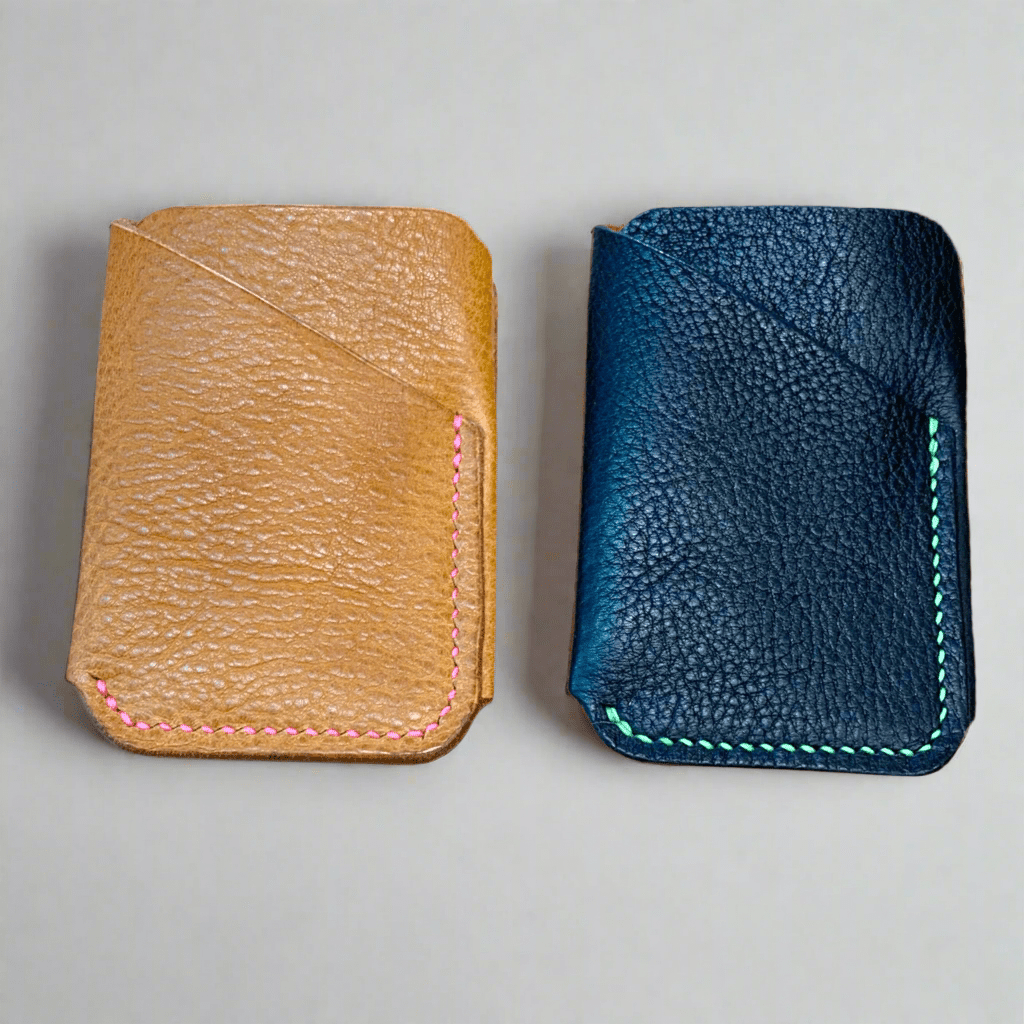 2 Walton Leather Wrap Wallets. One in lught tan and the other in black both with neon thread