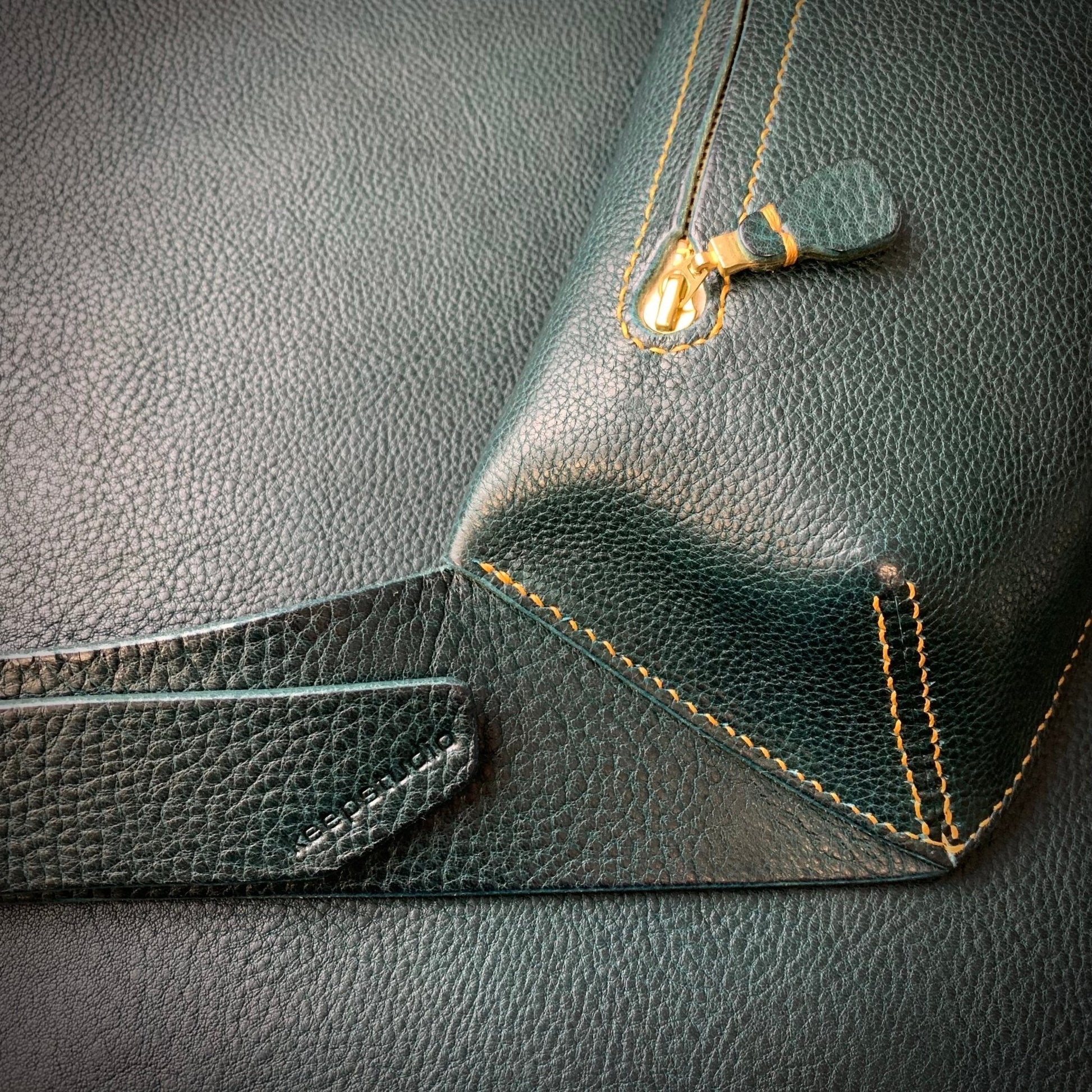 Elton Leather Belt Bag - Large - Keep - Studio close up of the cross body belt bag in petrol leather with mustard stitching 