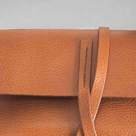 close up of a Light Tan Tumbled leather ipad case with tie fastening 